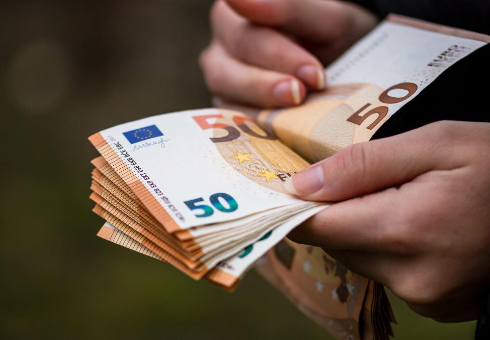 closeup female hands counting euro banknotes world money inflation economy concept