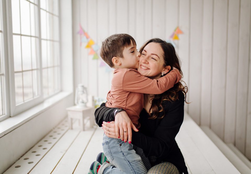 mother her son are posing studio wearing casual clothes