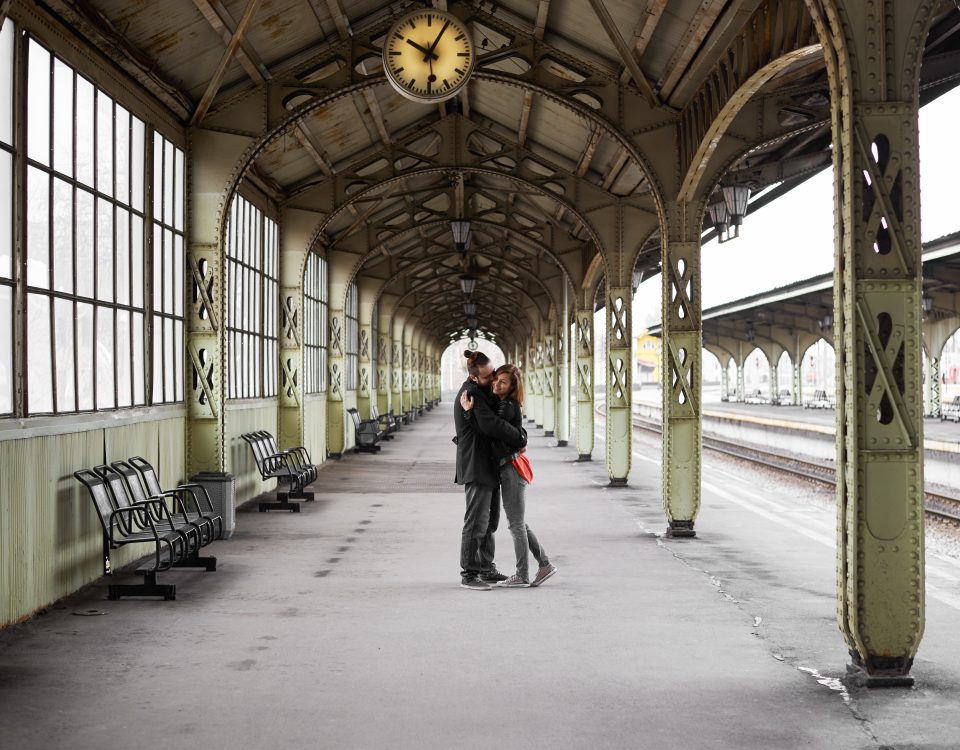 two lovers hug kiss railway station